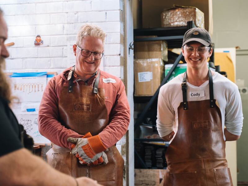 A father and son at a metalwork class